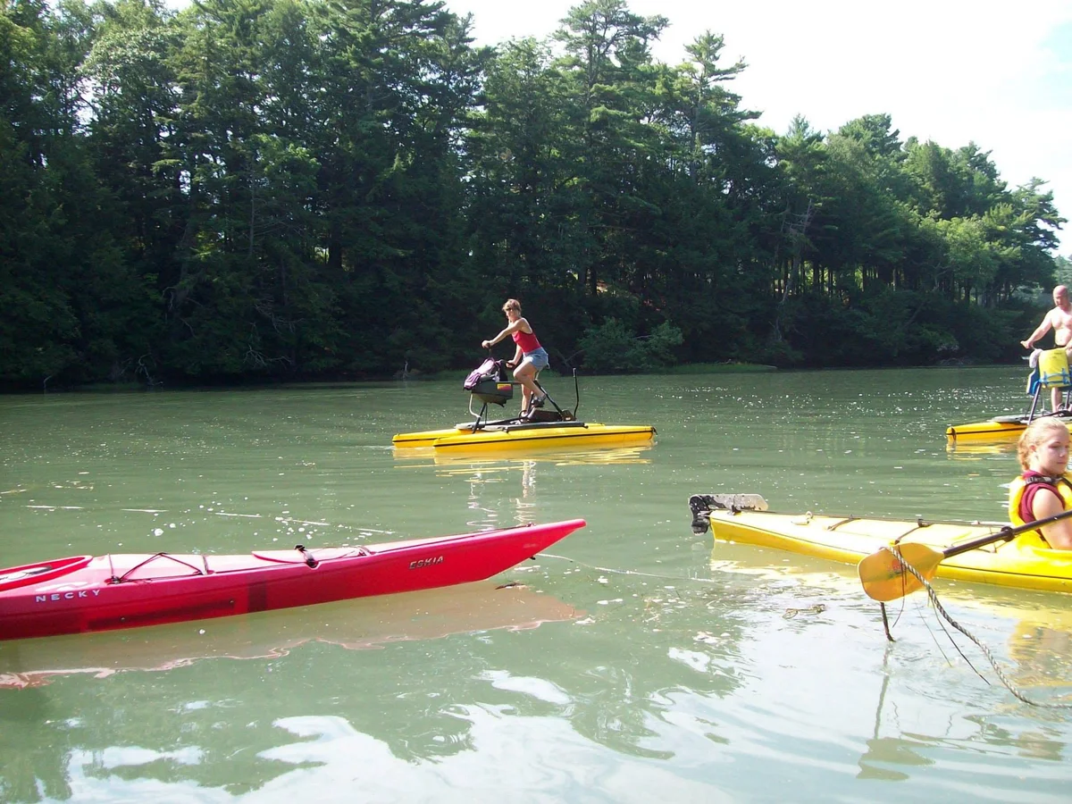 Paddlers and a water-bike on the Harraseeket River in South Freeport
